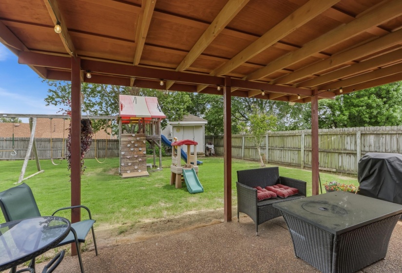 Covered patio featuring a wood ceiling, recessed lighting, and a textured concrete surface