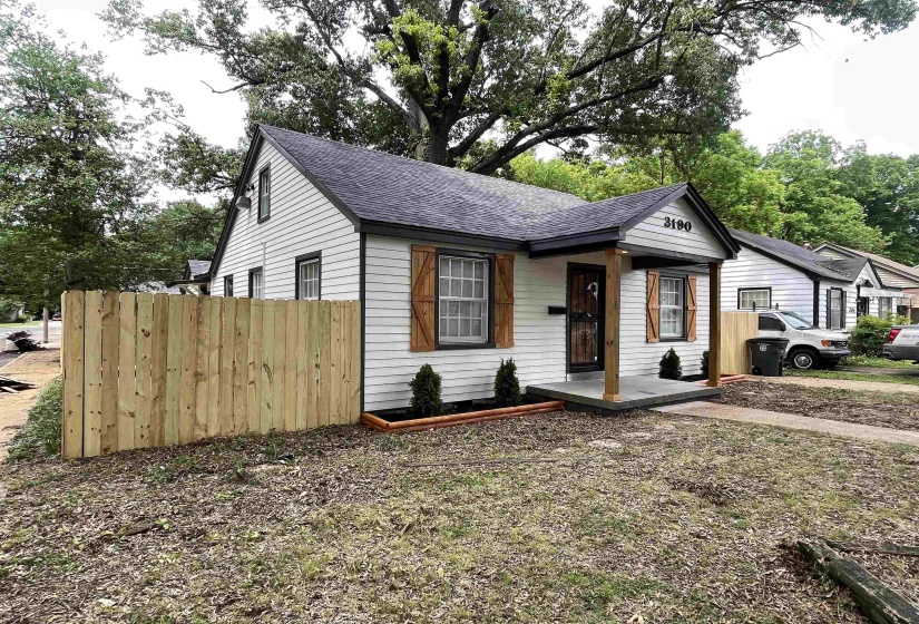 White siding exterior with dark trim accents