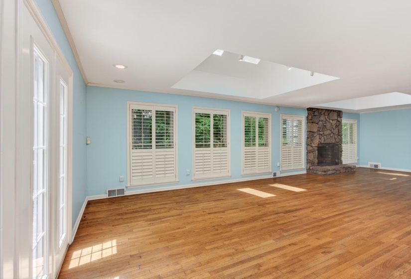 There are two new Velux skylights in this room that add even more natural light, with the surrounding windows filled with hues of green from the mature landscaping that awaits just outside.  *The skylights do have blinds as well.