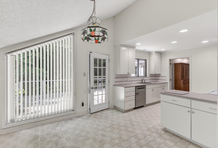 The welcoming breakfast area is perfect for casual dining, morning coffee or breakfast with family.  And, the large window offers fabulous views of the rear deck and beautifully landscaped grounds.