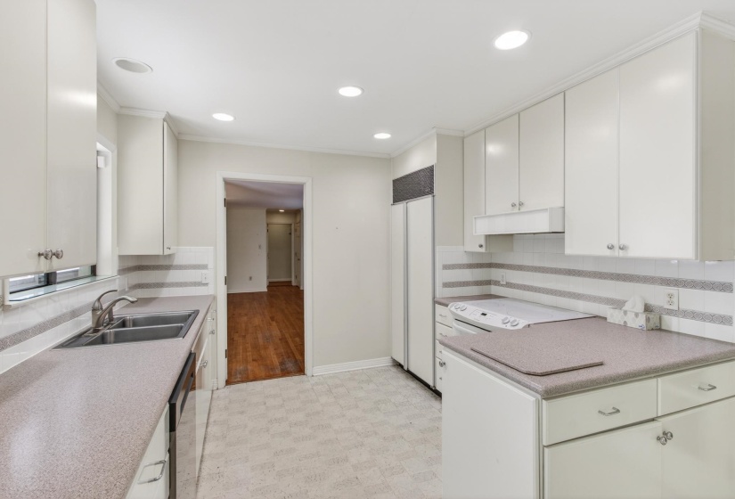 The kitchen space blends style and practicality with ample prep space and a breakfast bar, too!