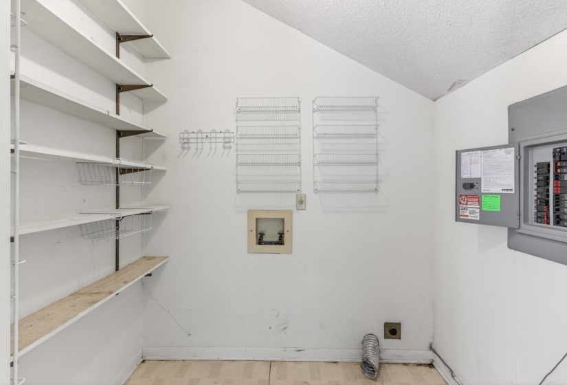 The laundry room is good in size, and offers shelving for some extra pantry space as well.