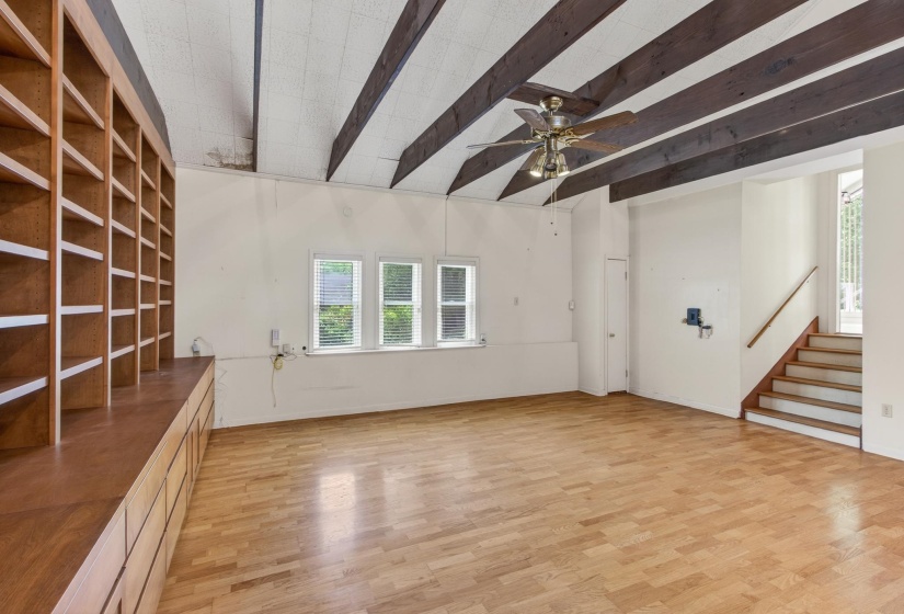 Custom built-ins provide both style and functionality, making this space ideal for relaxing, entertaining, a media or music room, or an impressive home office!