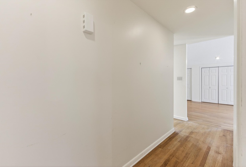 This primary suite garners it's own private hallway!