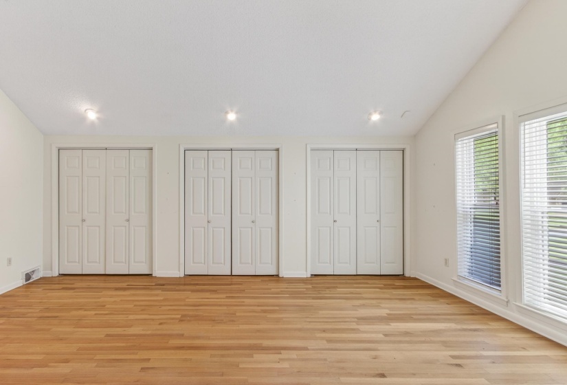 Three generous double closets provide exceptional storage, while the unique design elements of the room create a peaceful and sophisticated retreat.