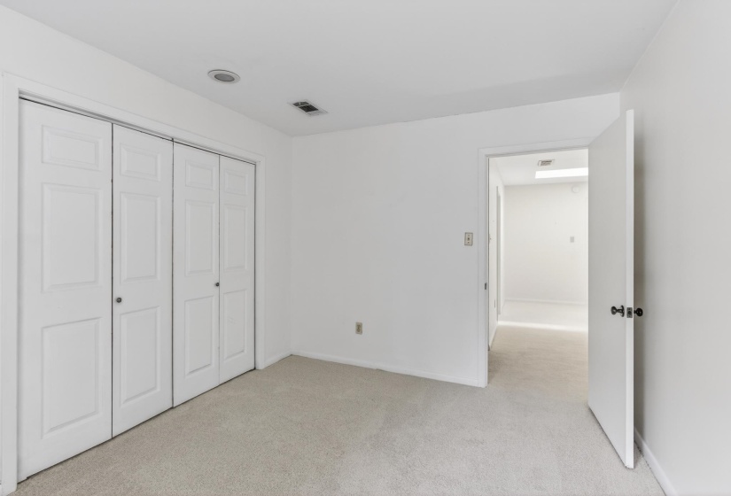 Opposing view of the fourth bedroom looking towards the loft space.