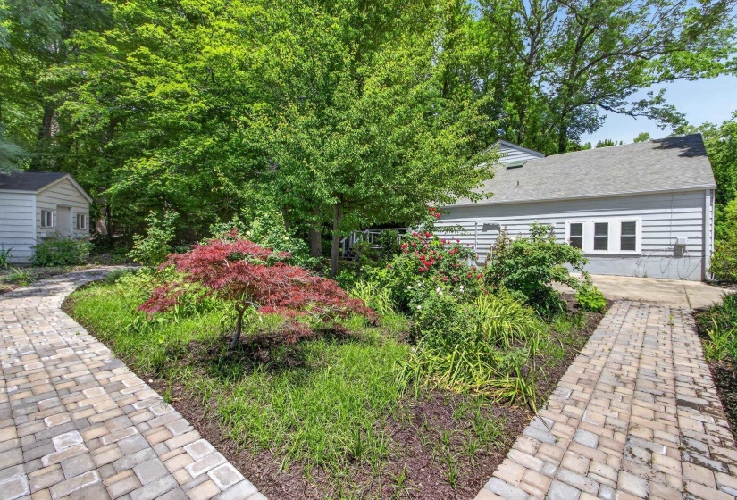 The grounds have been lovingly planted and maintained by the owner.  The paver walks and irrigation were added in 2024.