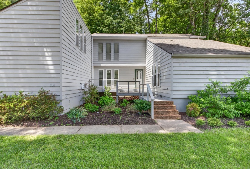 The warm and inviting entry, with it's clean architectural lines, is a welcoming first impression!