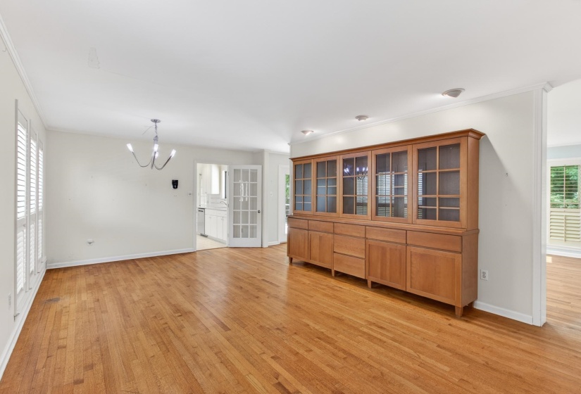 The formal dining room offers a custom built-in and leads into the massive living room on either side.