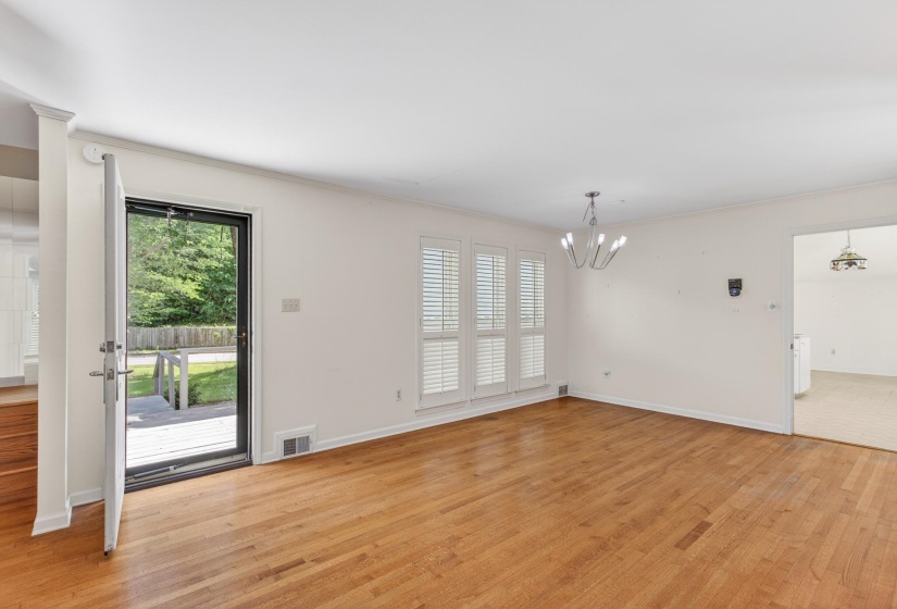 Looking on towards the kitchen from the dining room space.