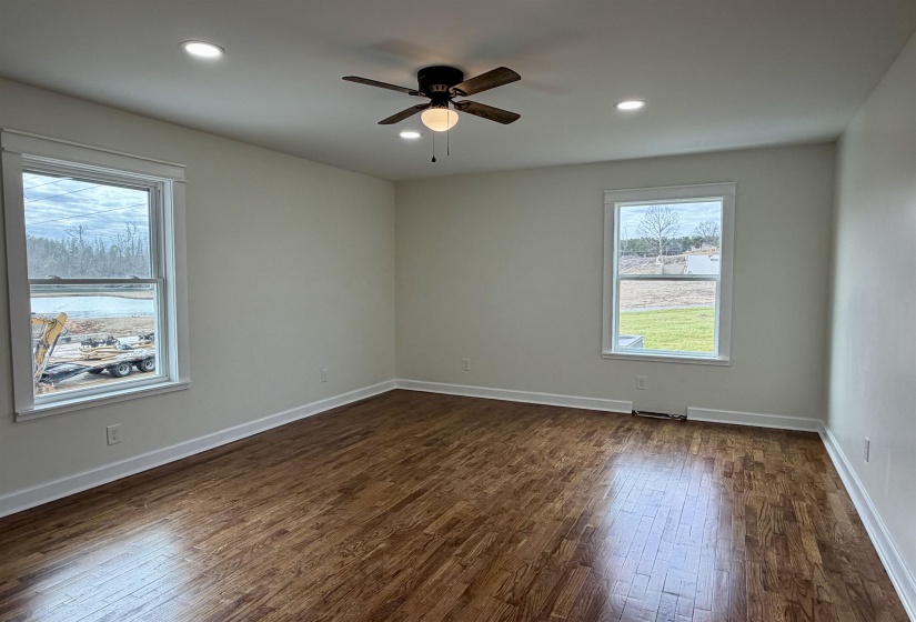 Unfurnished room with dark wood-style floors, recessed lighting, and a ceiling fan