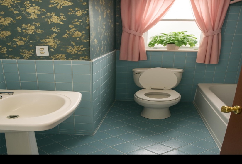 Full bath with light tile patterned floors, wallpapered walls, tile walls, and wainscoting