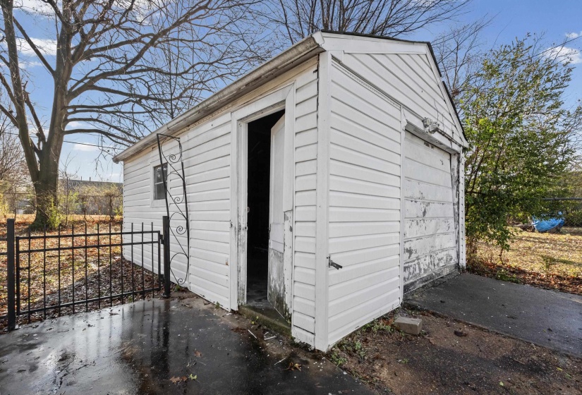 View of outbuilding featuring a garage
