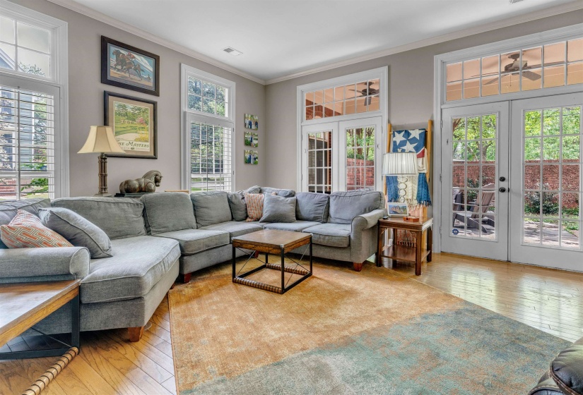 Living space featuring light wood flooring and neutral wall tones