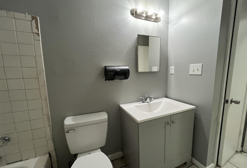 Full bath with vanity and toilet