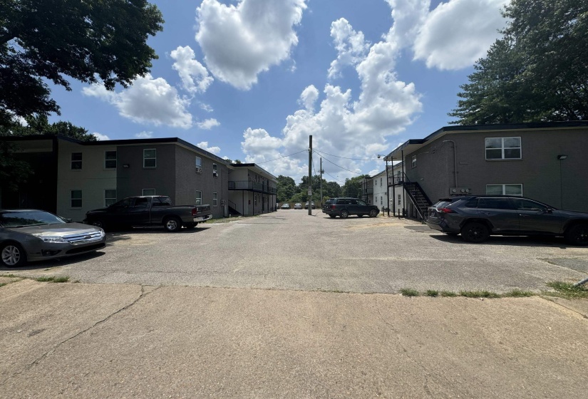 Expansive paved lot providing access to multi-level residential structures