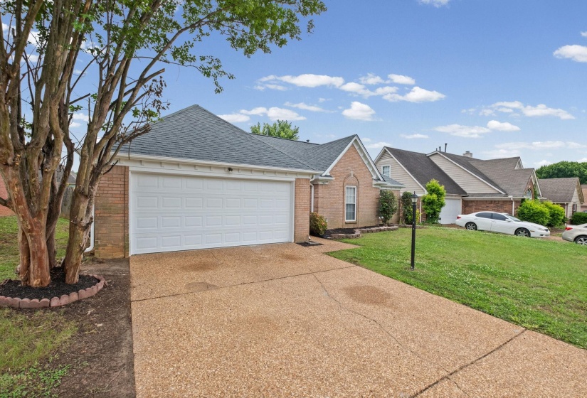 Brick-front exterior with an attached two-car garage