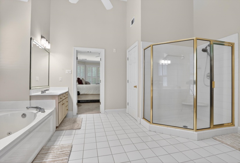 Spacious primary bathroom with large shower.
