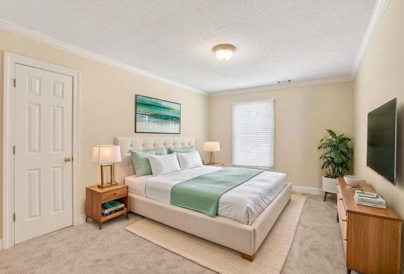 Very nice size bedroom with walk in closet. This is virtual staging.