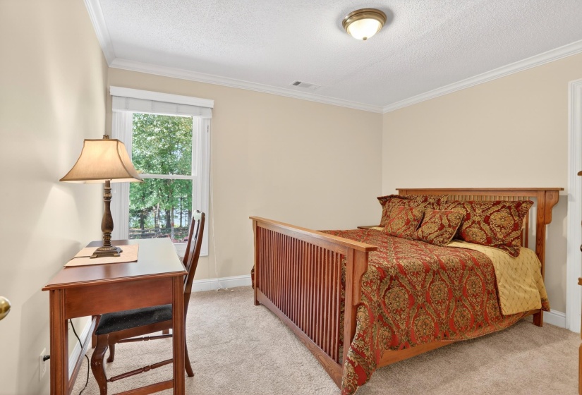 This bedroom has a beautiful view of the lake also.