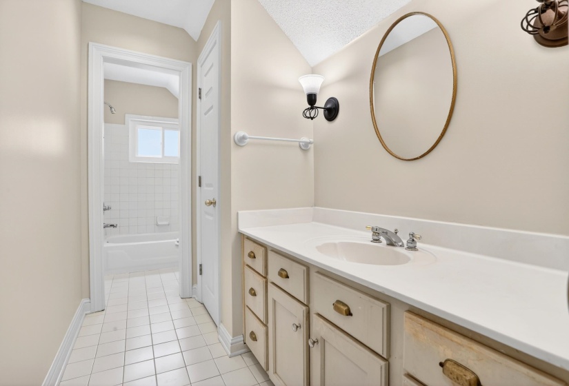 This full bath is located upstairs also.