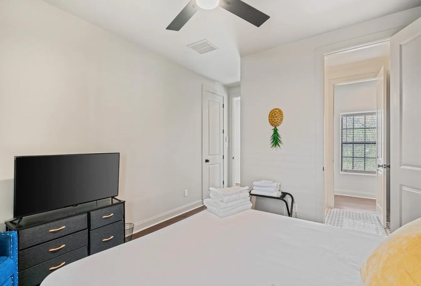 Bedroom featuring wood finished floors and ceiling fan