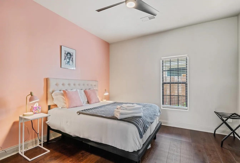 Bedroom featuring dark wood-type flooring and ceiling fan