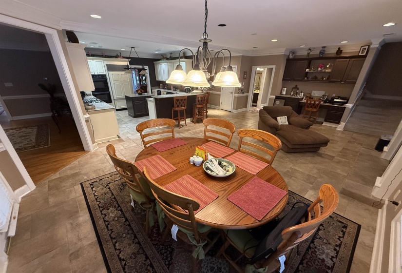 Dining area featuring recessed lighting and ornamental molding