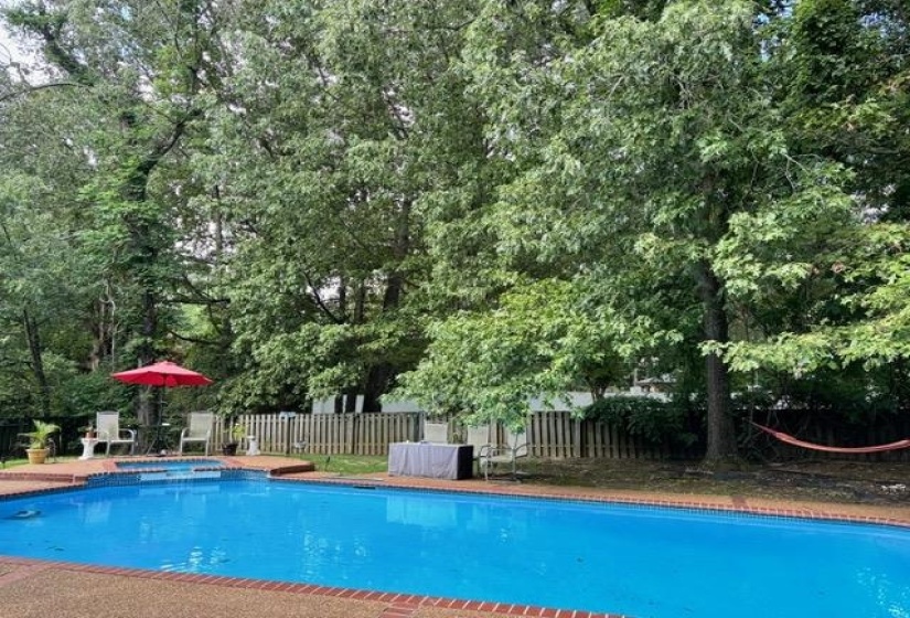 View of swimming pool with hot tub