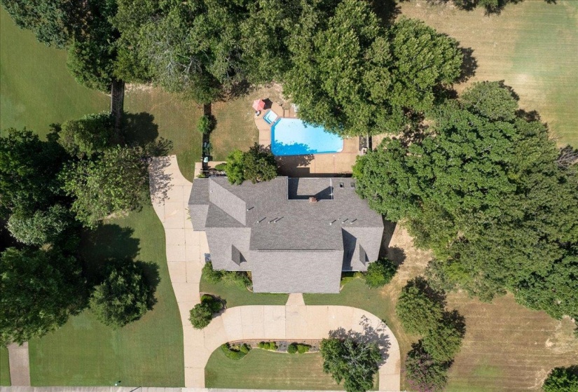 Aerial view of property's location featuring a pool