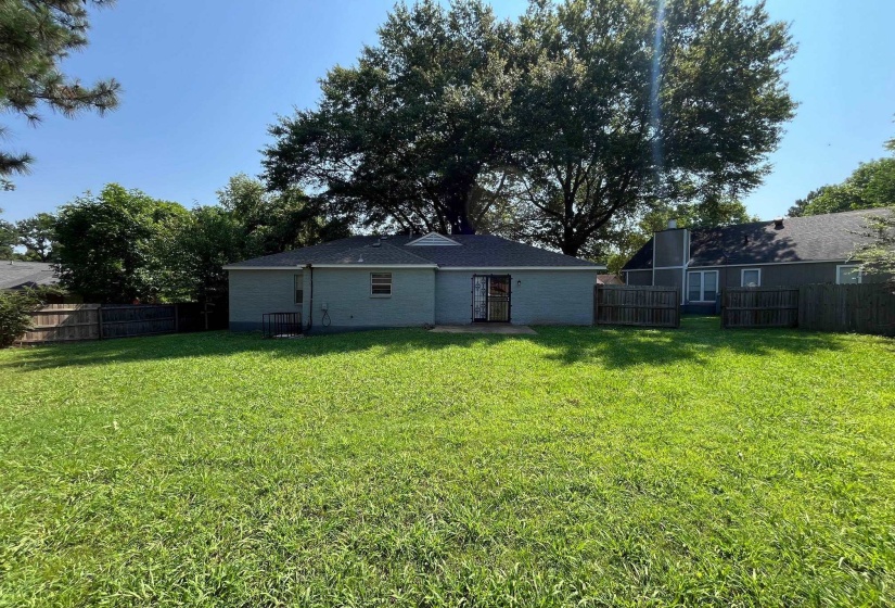 Expansive grassy lawn providing ample outdoor space