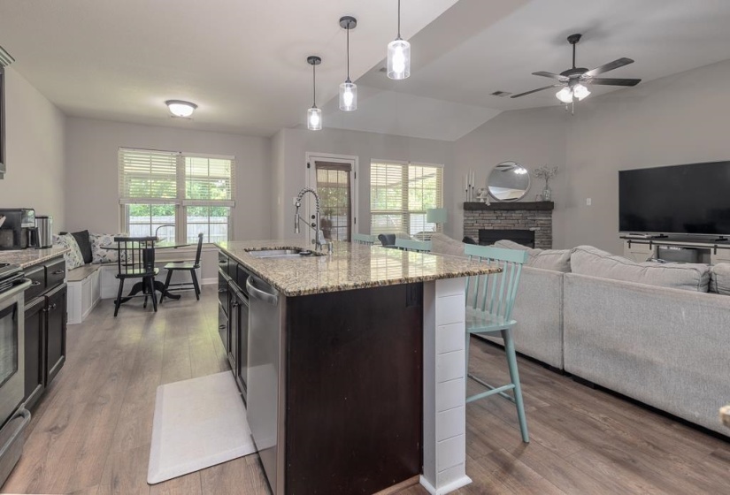 Kitchen island with granite countertops and undermount sink