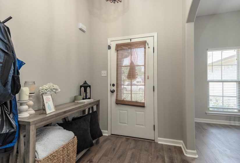 Entryway featuring wood-finish flooring and light gray wall paint