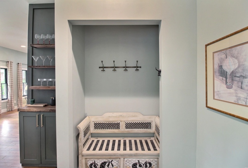 Handy spot to put on shoes or hang your coat or hat.