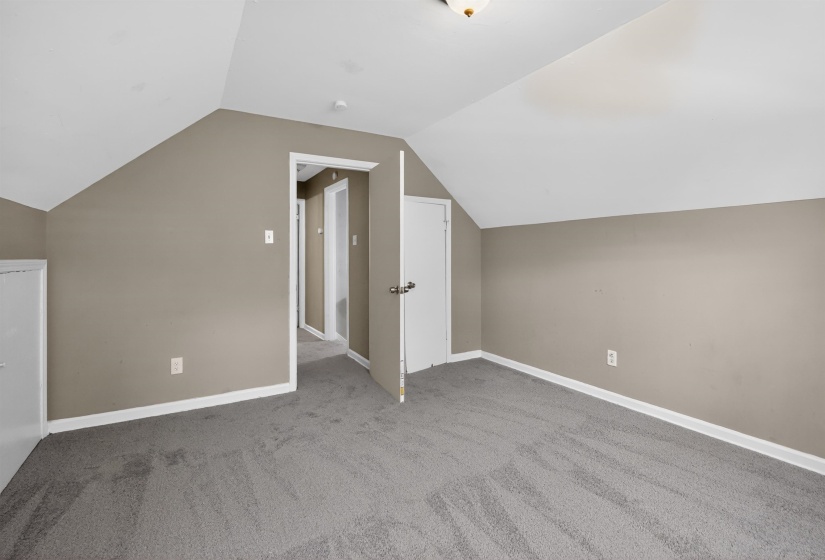 Soft gray carpet flooring complemented by neutral wall tones