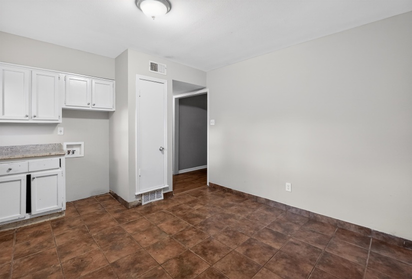 Neutral wall colors and durable tile flooring provide a versatile foundation