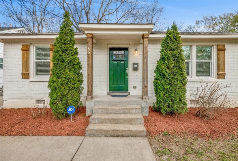 Entrance to property with crawl space and brick siding