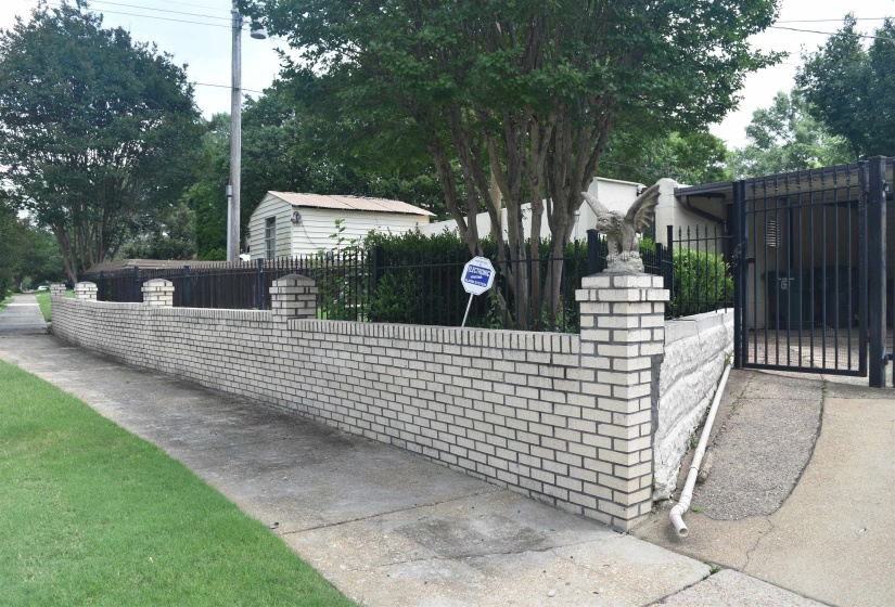 Front exterior brick wall featuring decorative brick columns