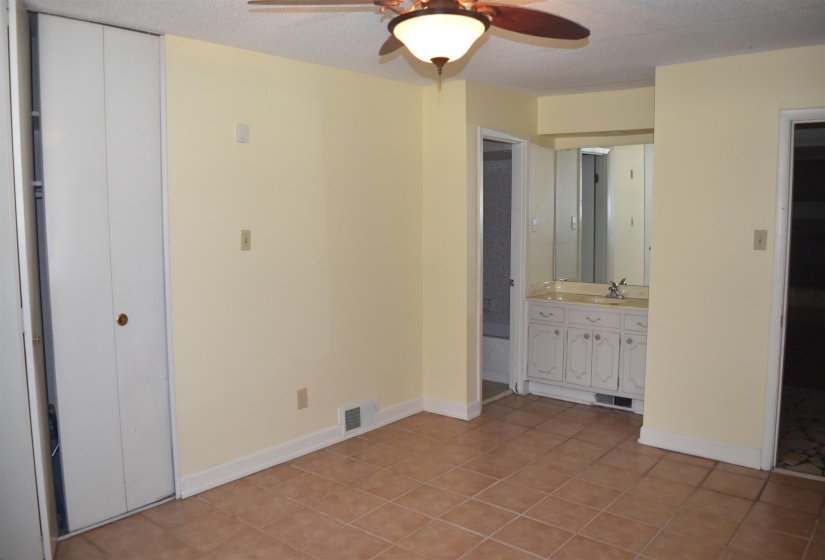 Neutral-toned tile flooring throughout the room