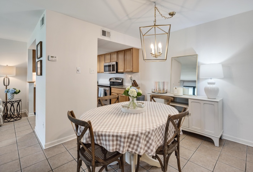 Dining area featuring an open-cage chandelier