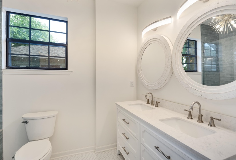 Double vanity featuring undermount sinks and brushed nickel fixtures