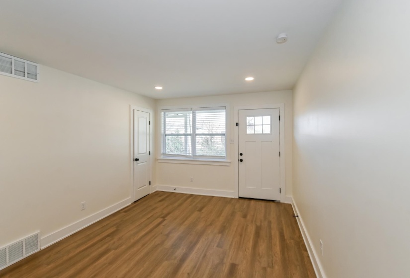 Neutral wall finishes with wood-finish flooring