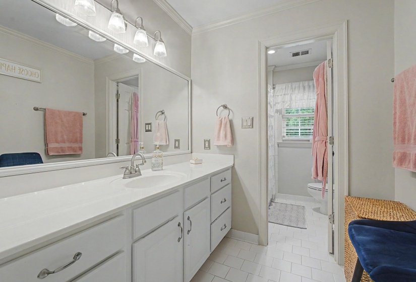 Bathroom vanity with a white countertop and integrated sink
