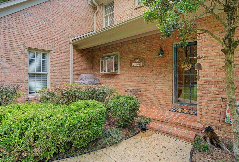 Brick exterior with a covered porch entry