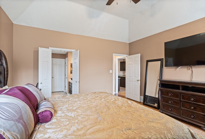 Bedroom featuring a vaulted ceiling and neutral wall tones