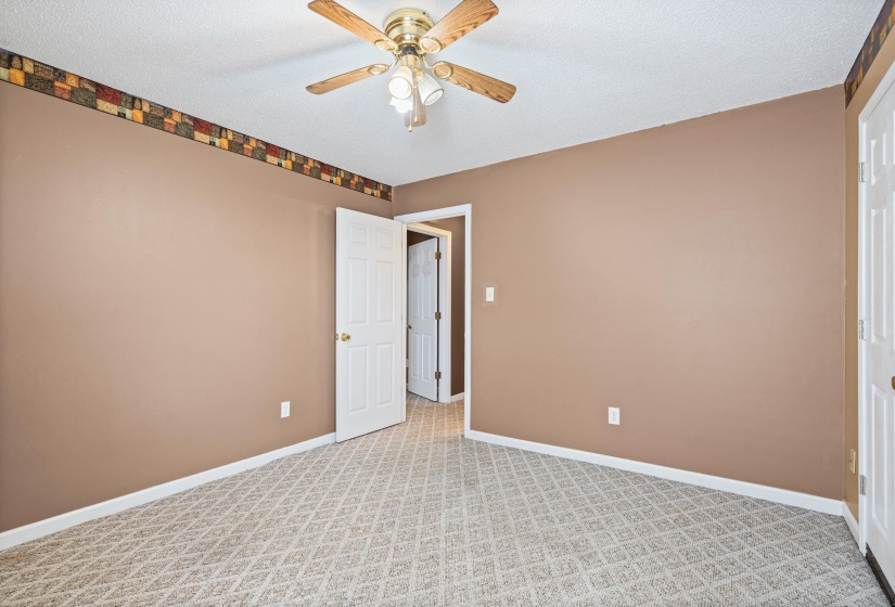 Neutral-toned walls with decorative border trim