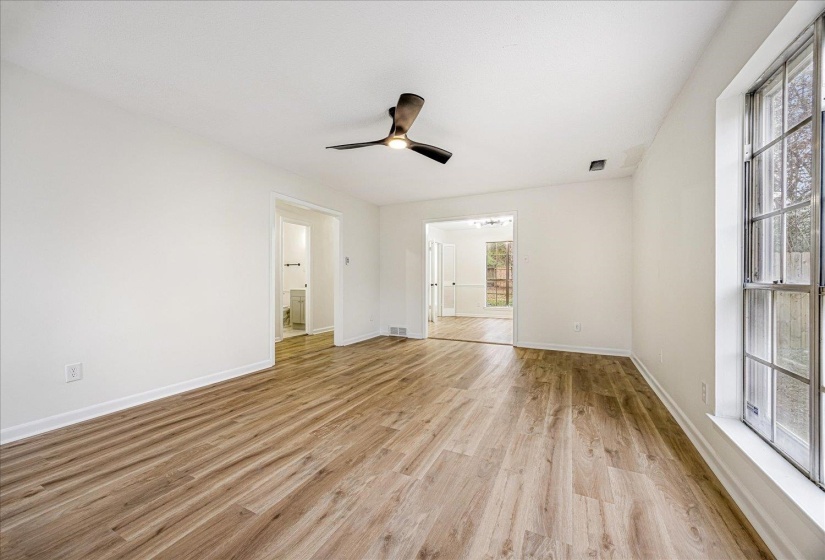 Unfurnished room with light wood-style floors and a ceiling fan