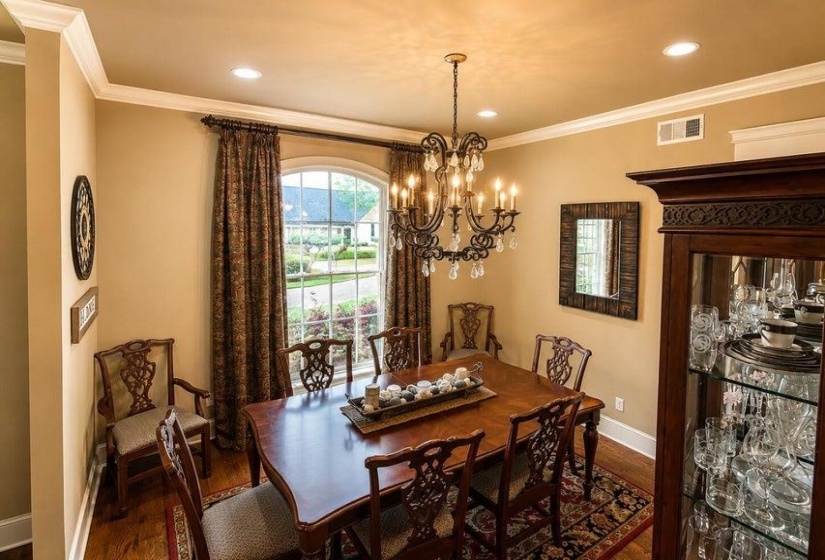 Dining area featuring crown molding, recessed lighting, and beautiful hardwood flooring.