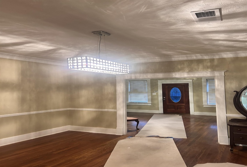 Diningroom featuring dark wood-style floors and baseboards