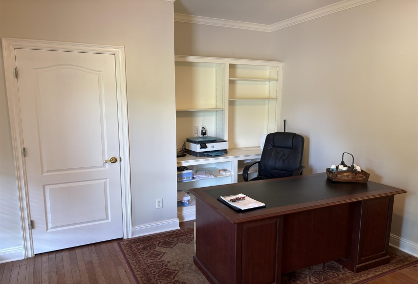 Built-in shelving and desk area featuring a light-toned countertop